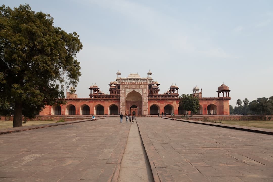 a large building with a lot of trees in front of it