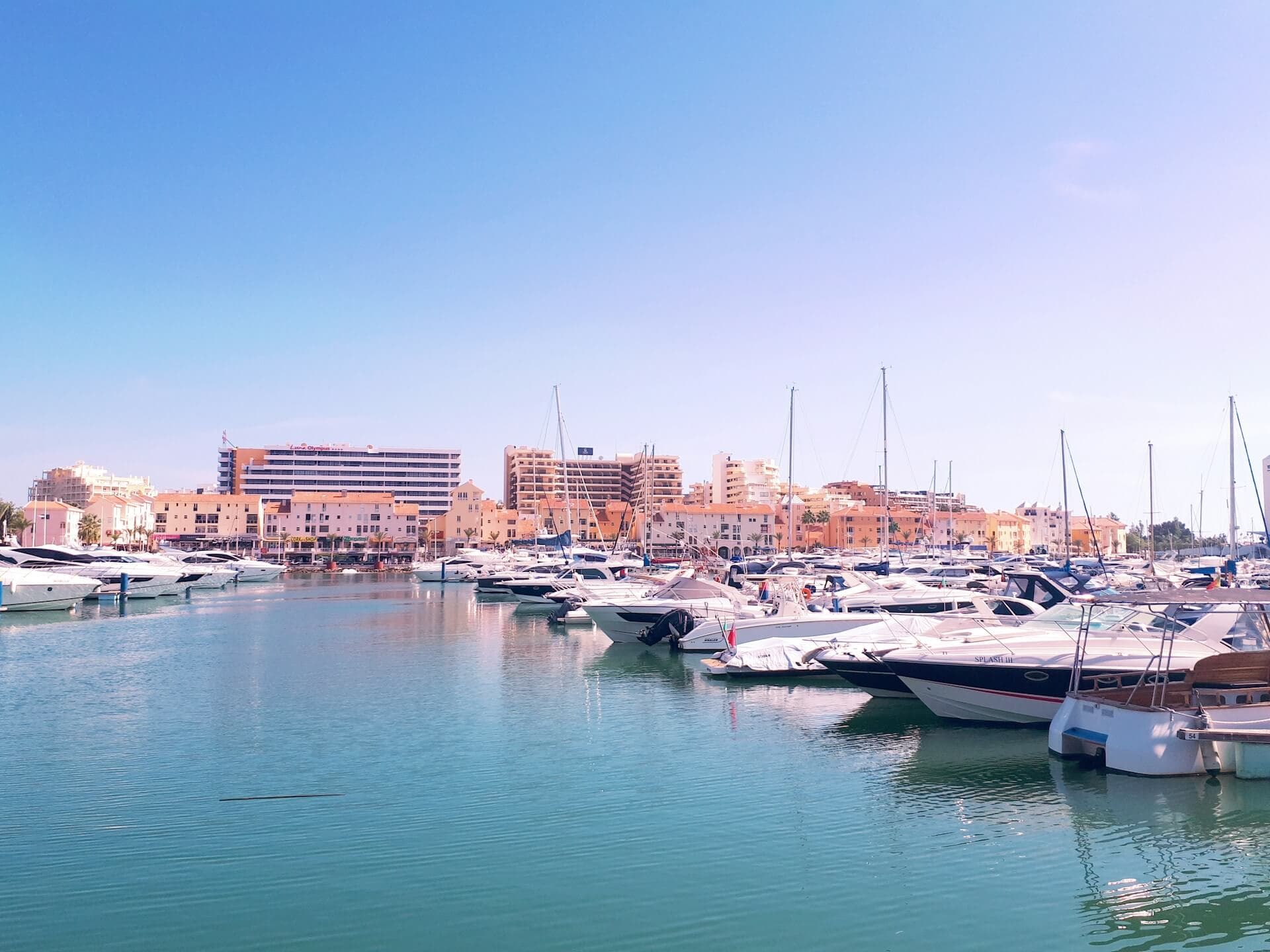 white boats in a pier