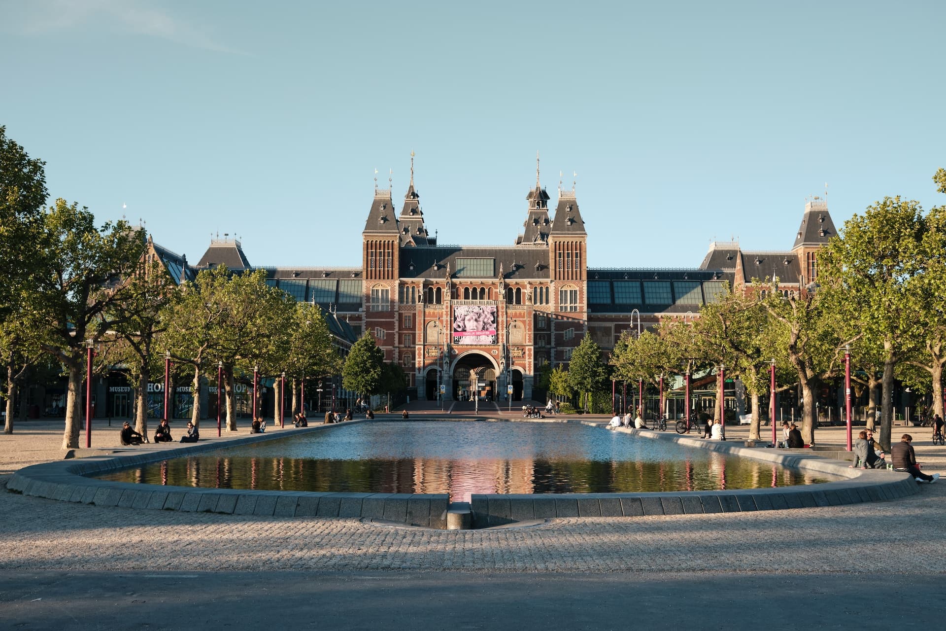 people walking in the park near the Brown building during the day