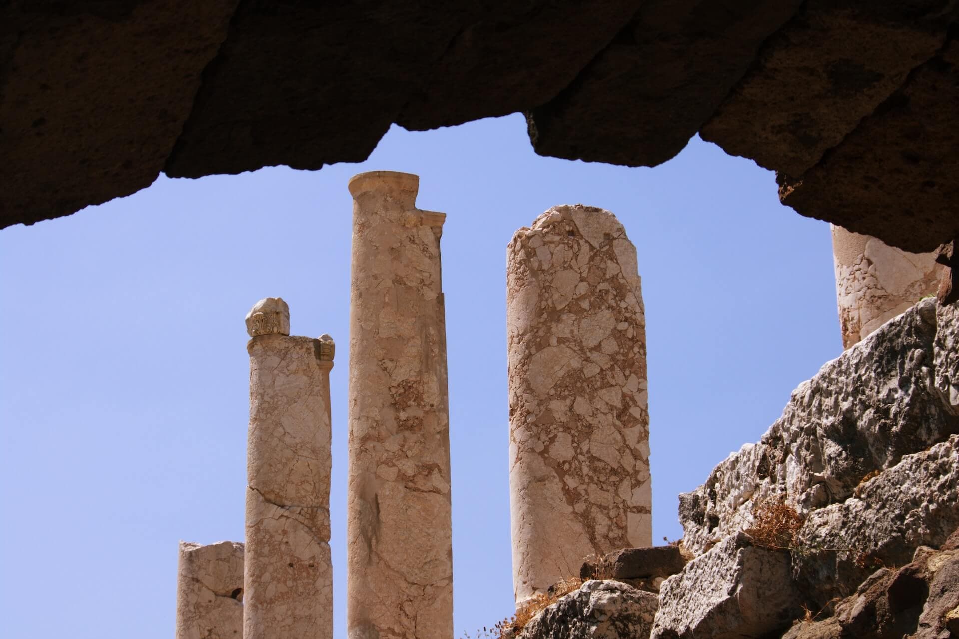 a group of stone pillars sitting side by side