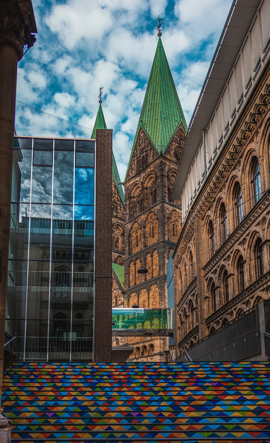 a very tall building with a clock tower in the background