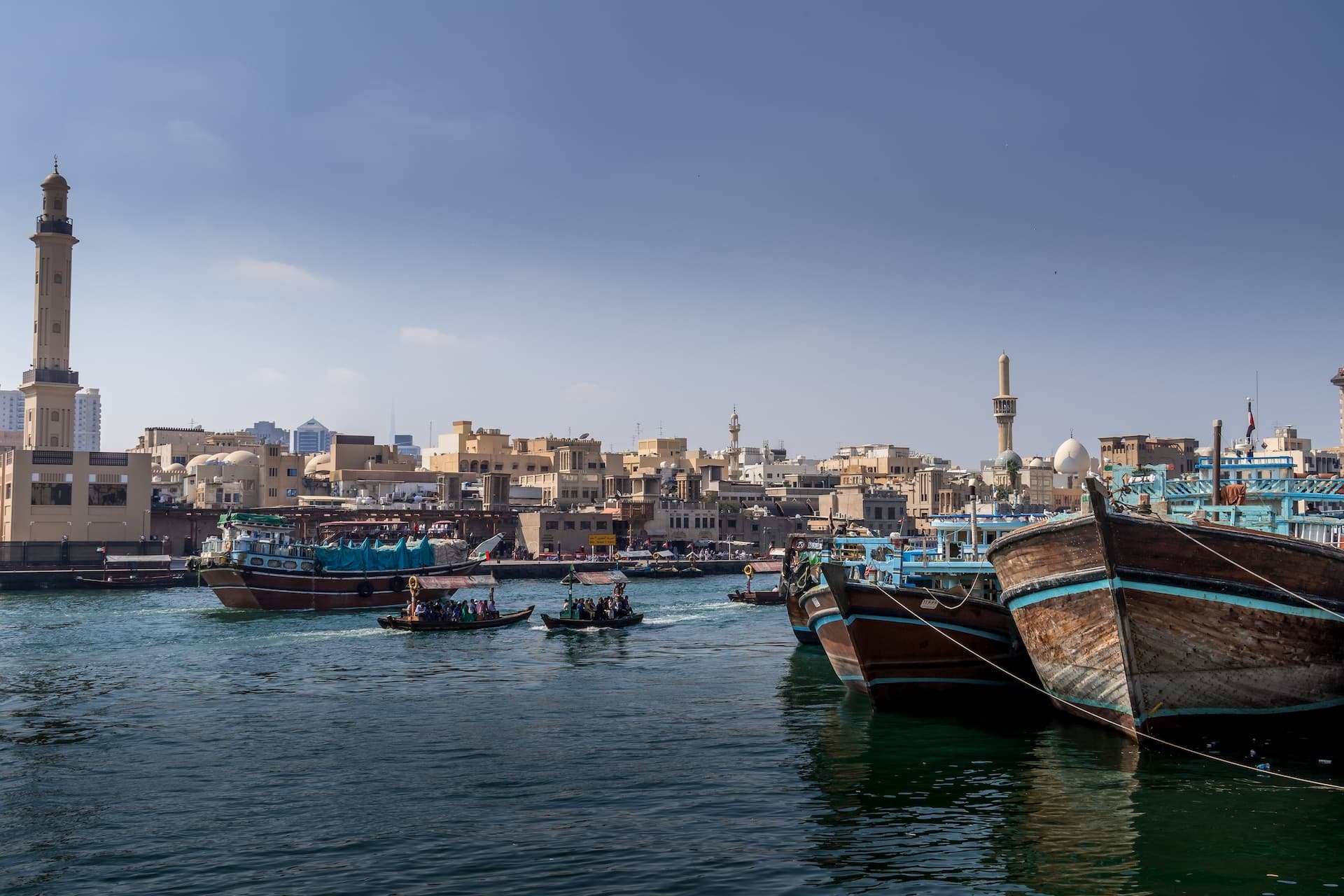 white and black boat on body of water during daytime