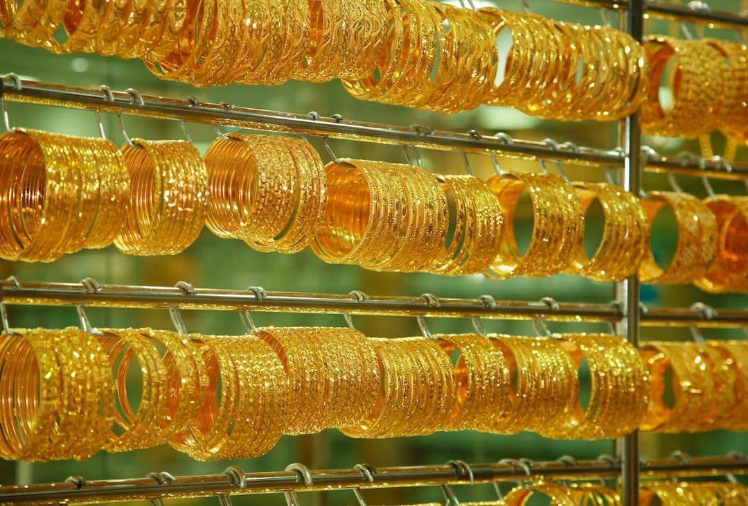 yellow and orange fruit on stainless steel rack