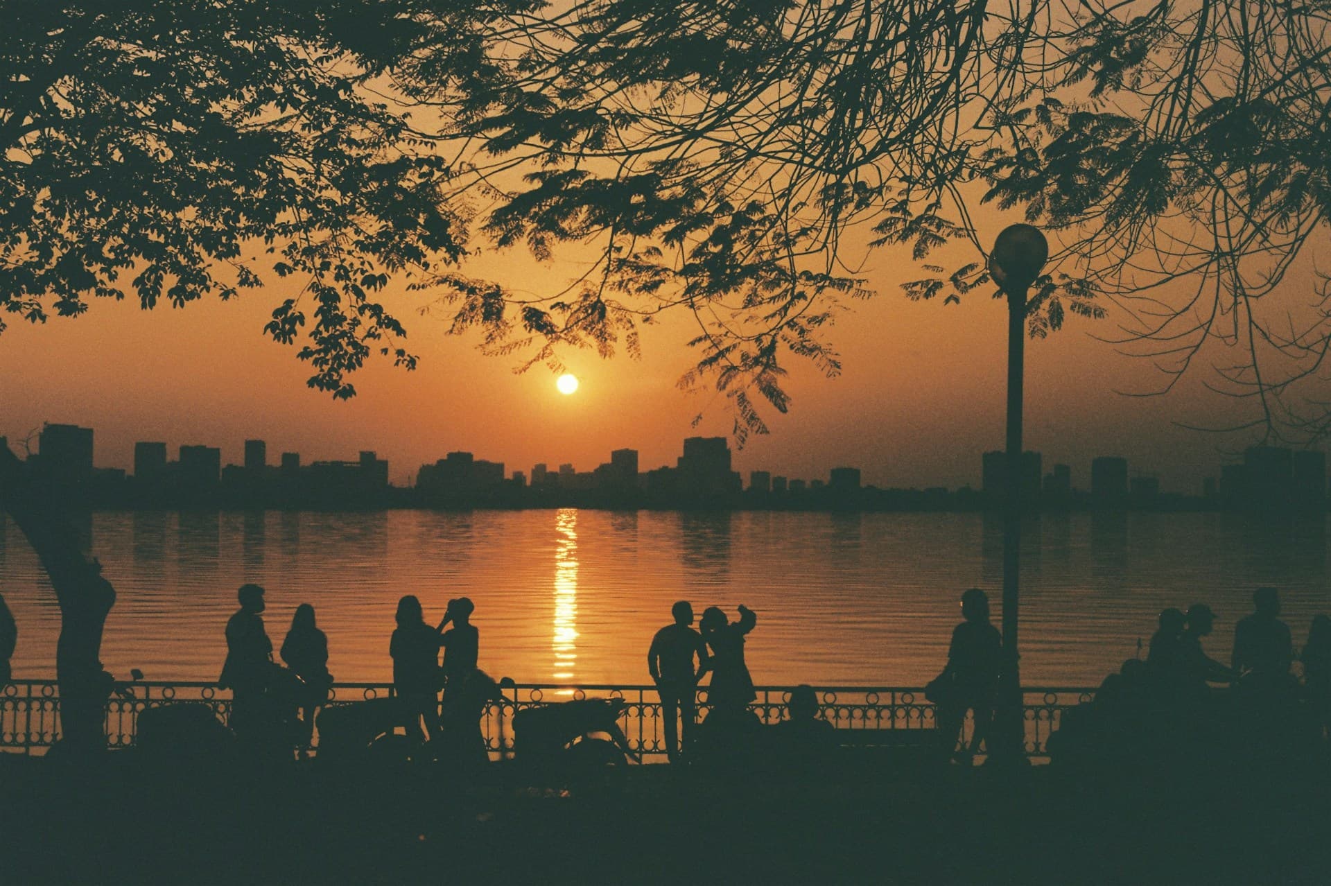 a large body of water with a city in the distance