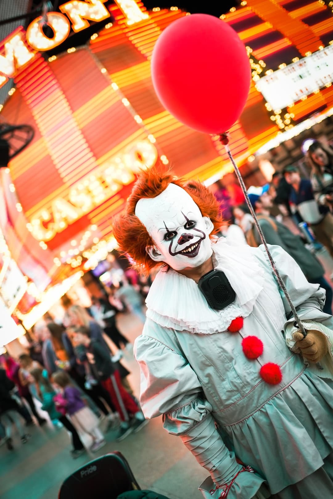 a person in a garment holding a balloon