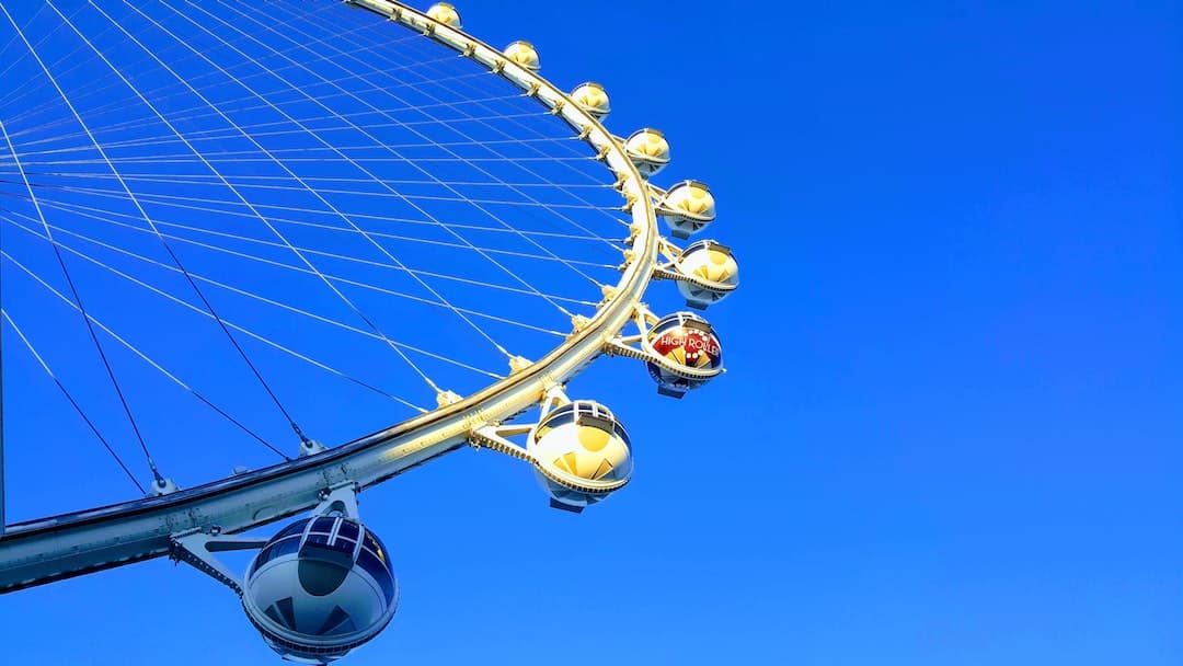 a ferris wheel is shown against a blue sky