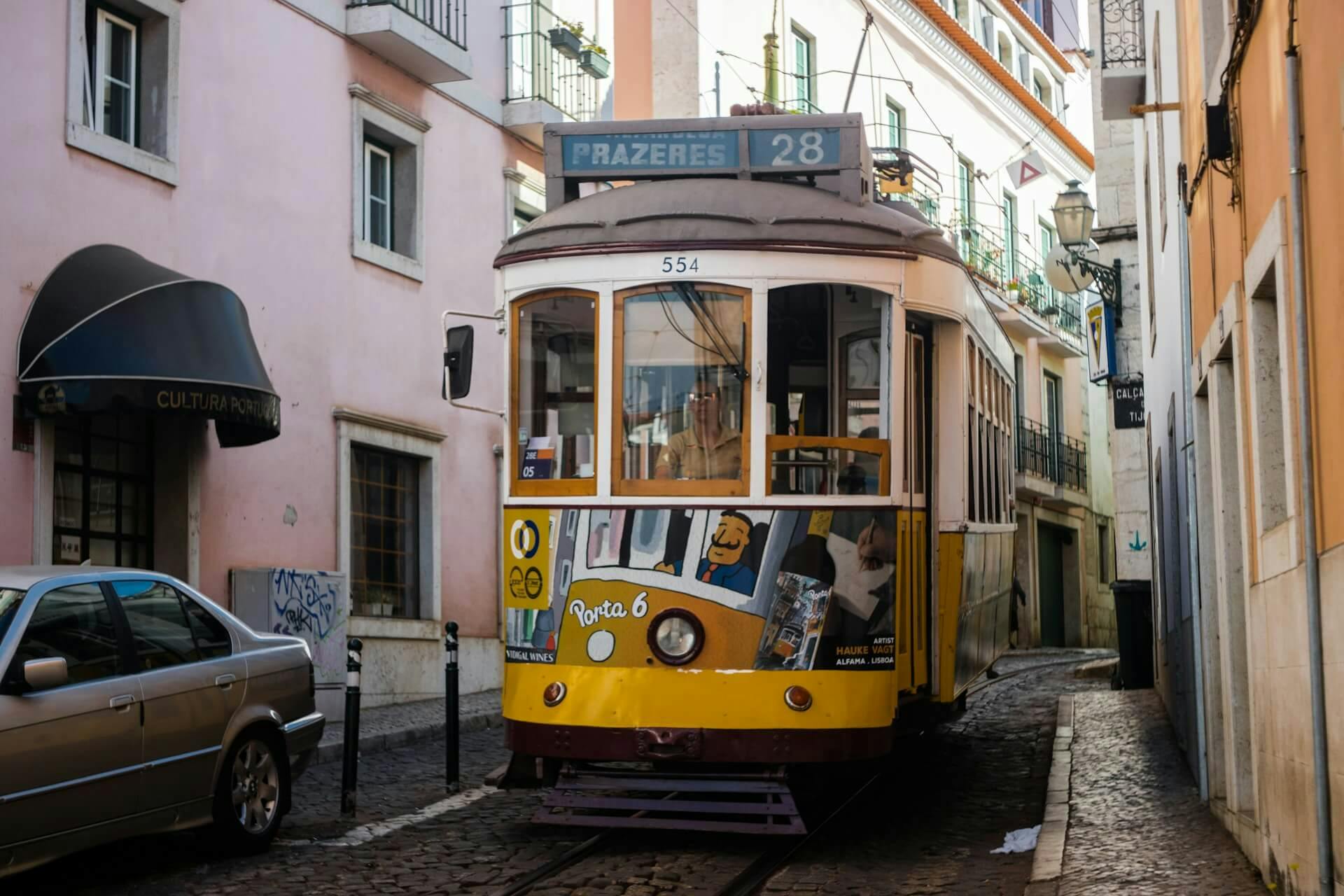 yellow and brown tram train near people