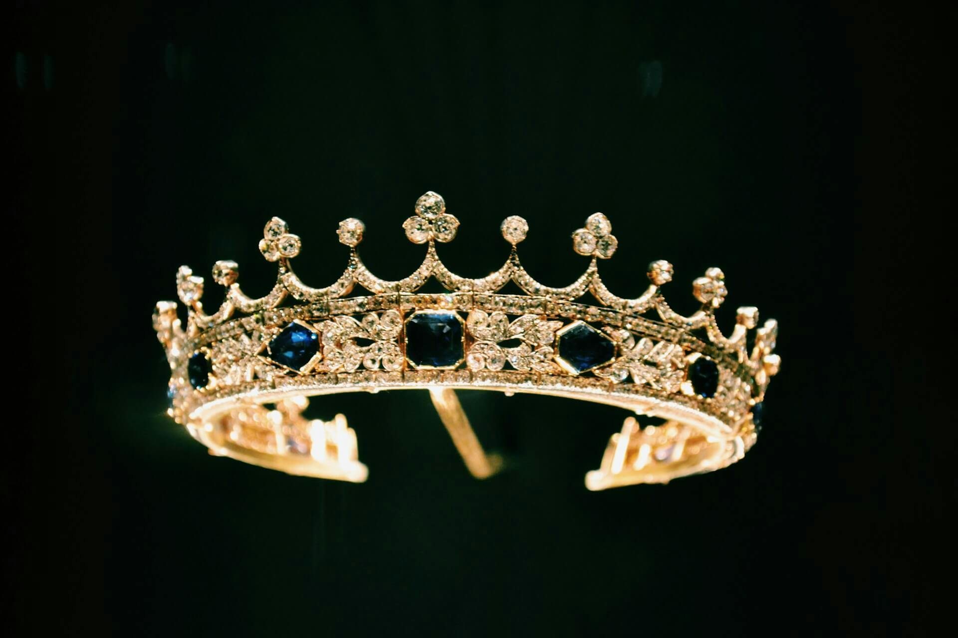 silver crown with diamonds with black background