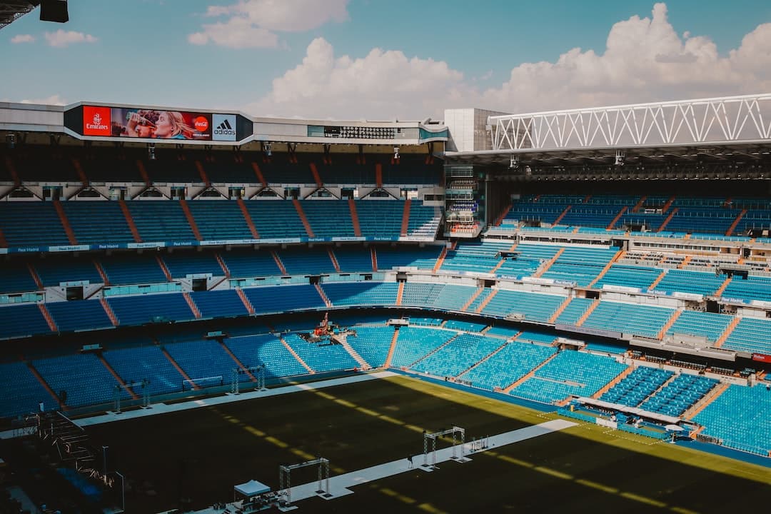 stadium with no people under blue and white skies