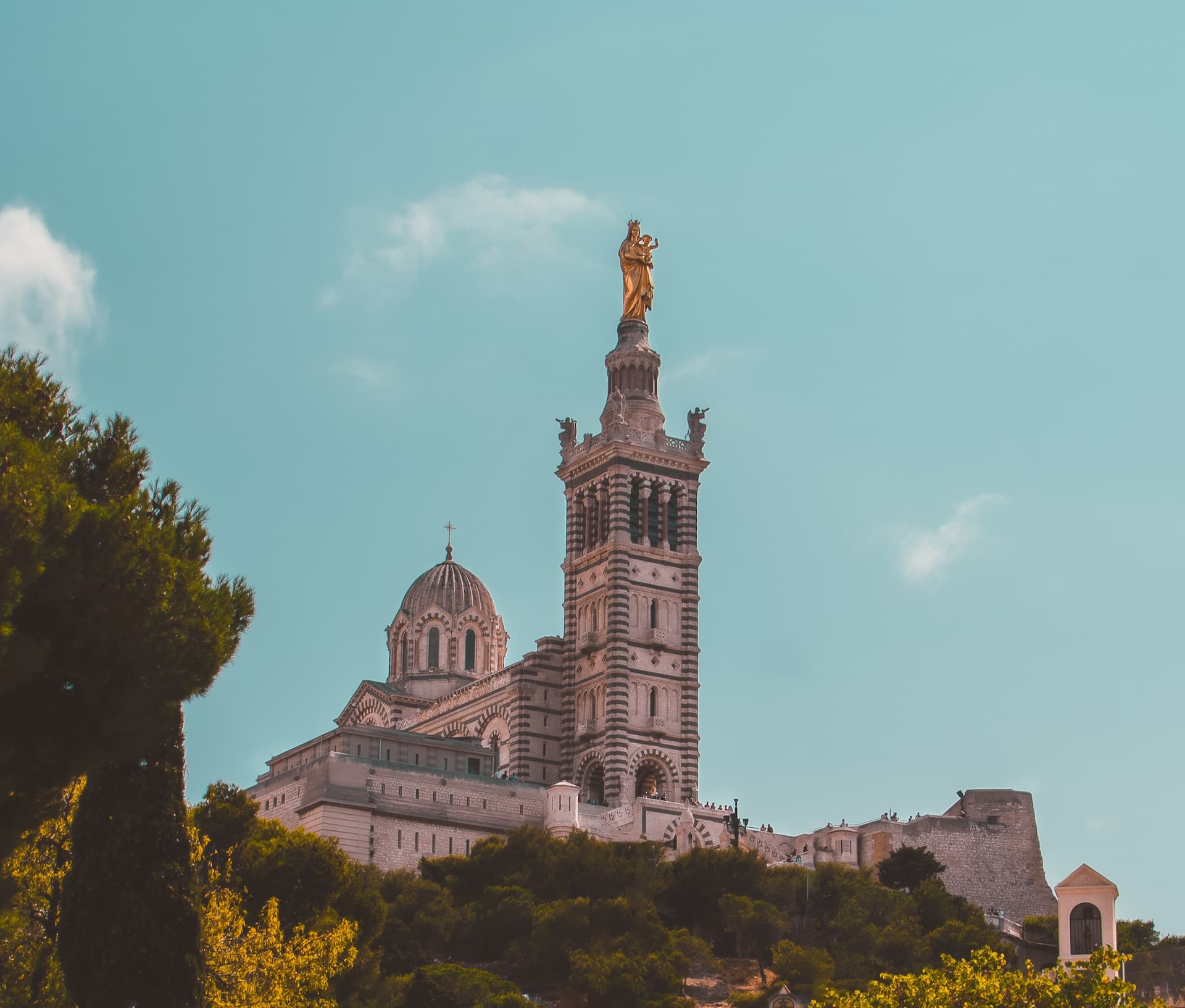 a golden statue on top of a building