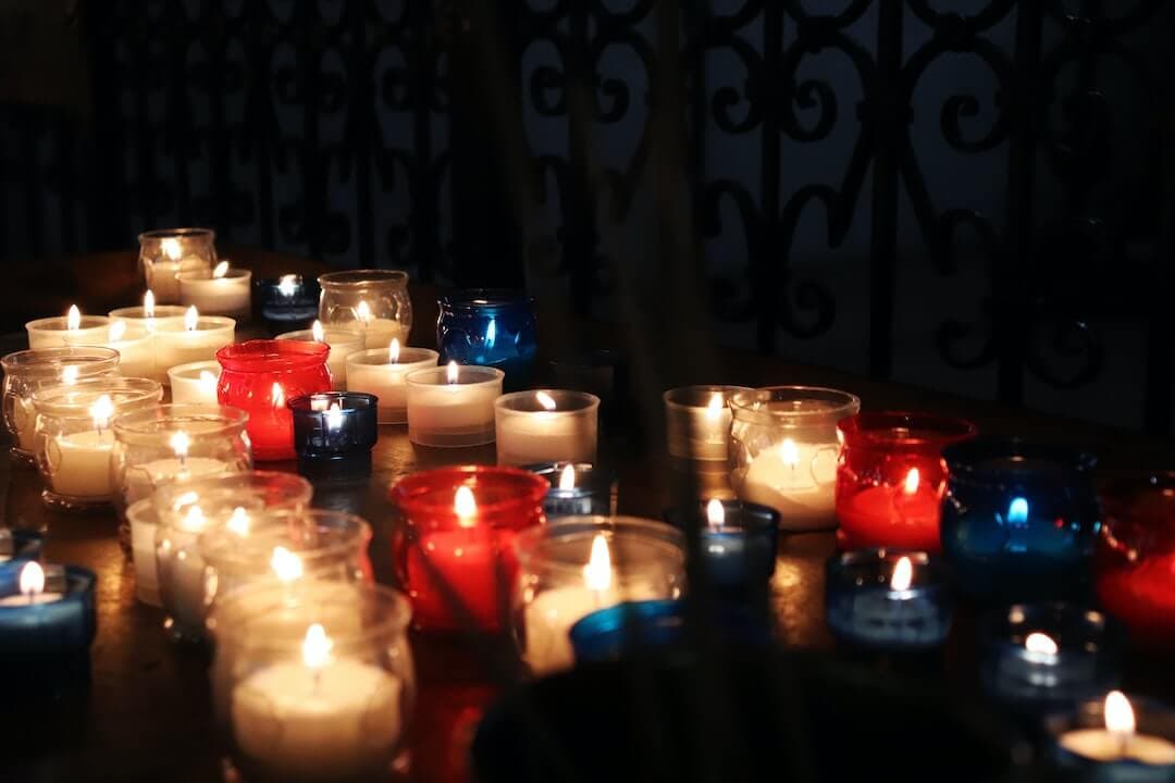 lighted candles on black metal candle holder