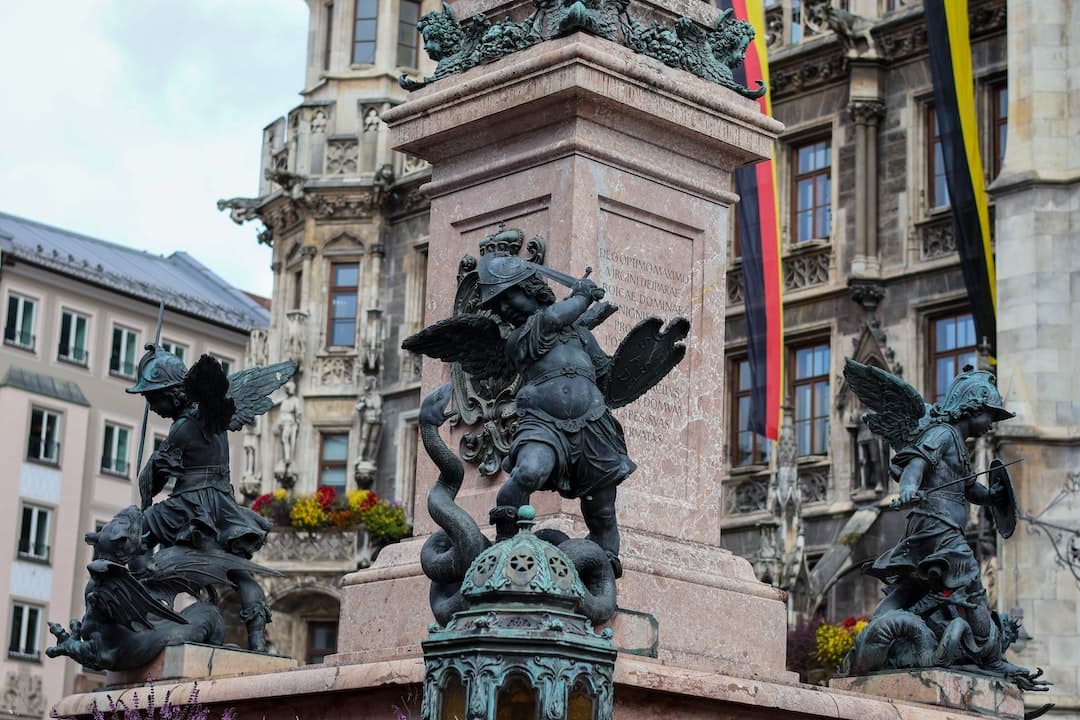 a group of statues outside of a building