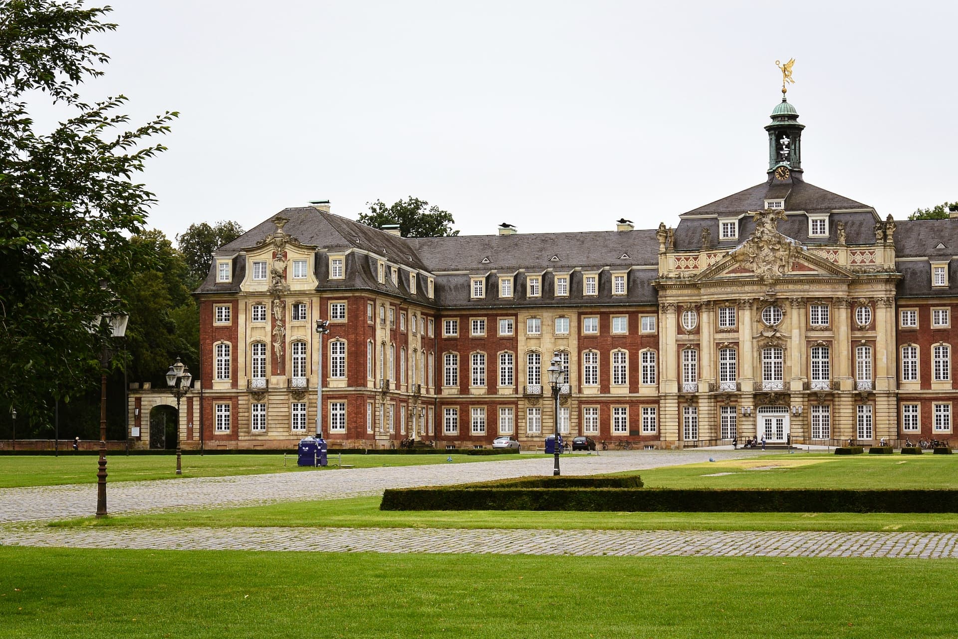 people walking near brown and white building