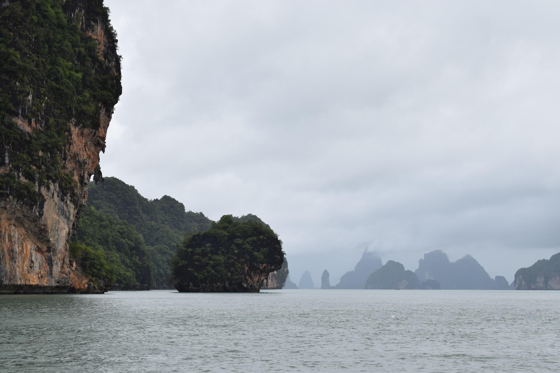 white and black boat on body of water during daytime