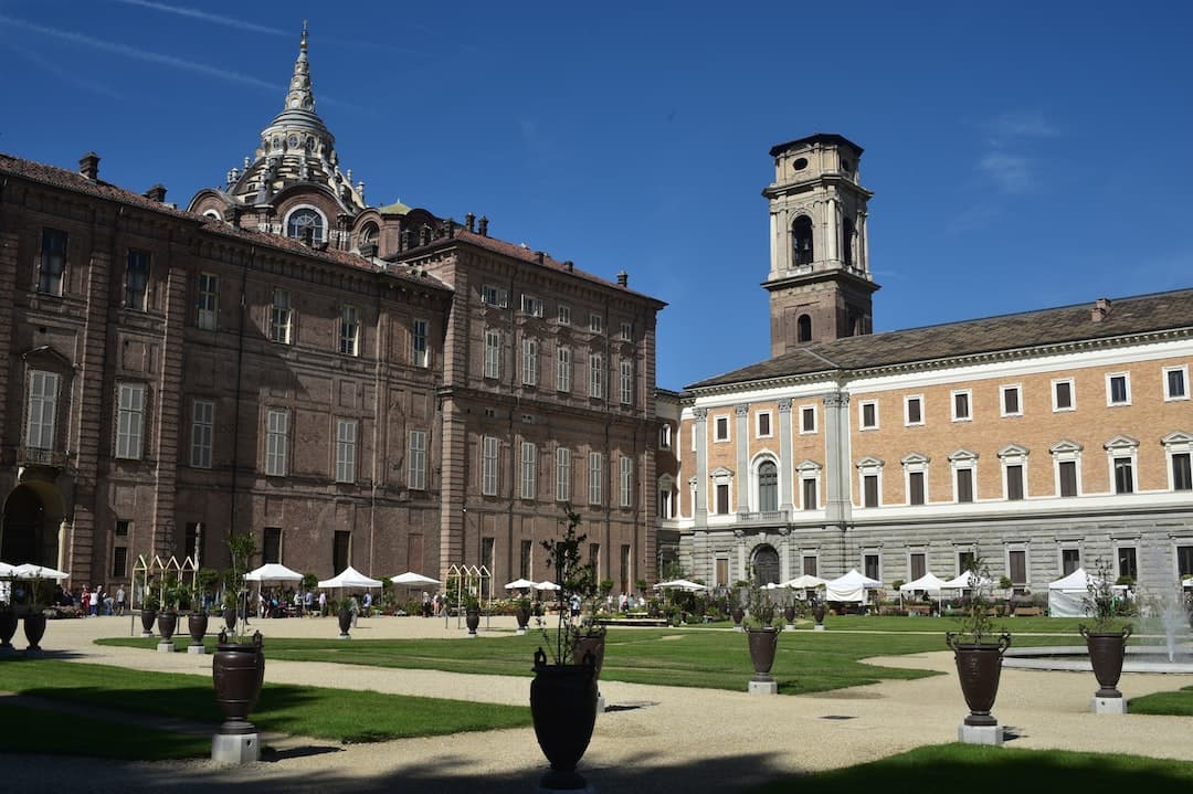 a large building with a clock tower in the background