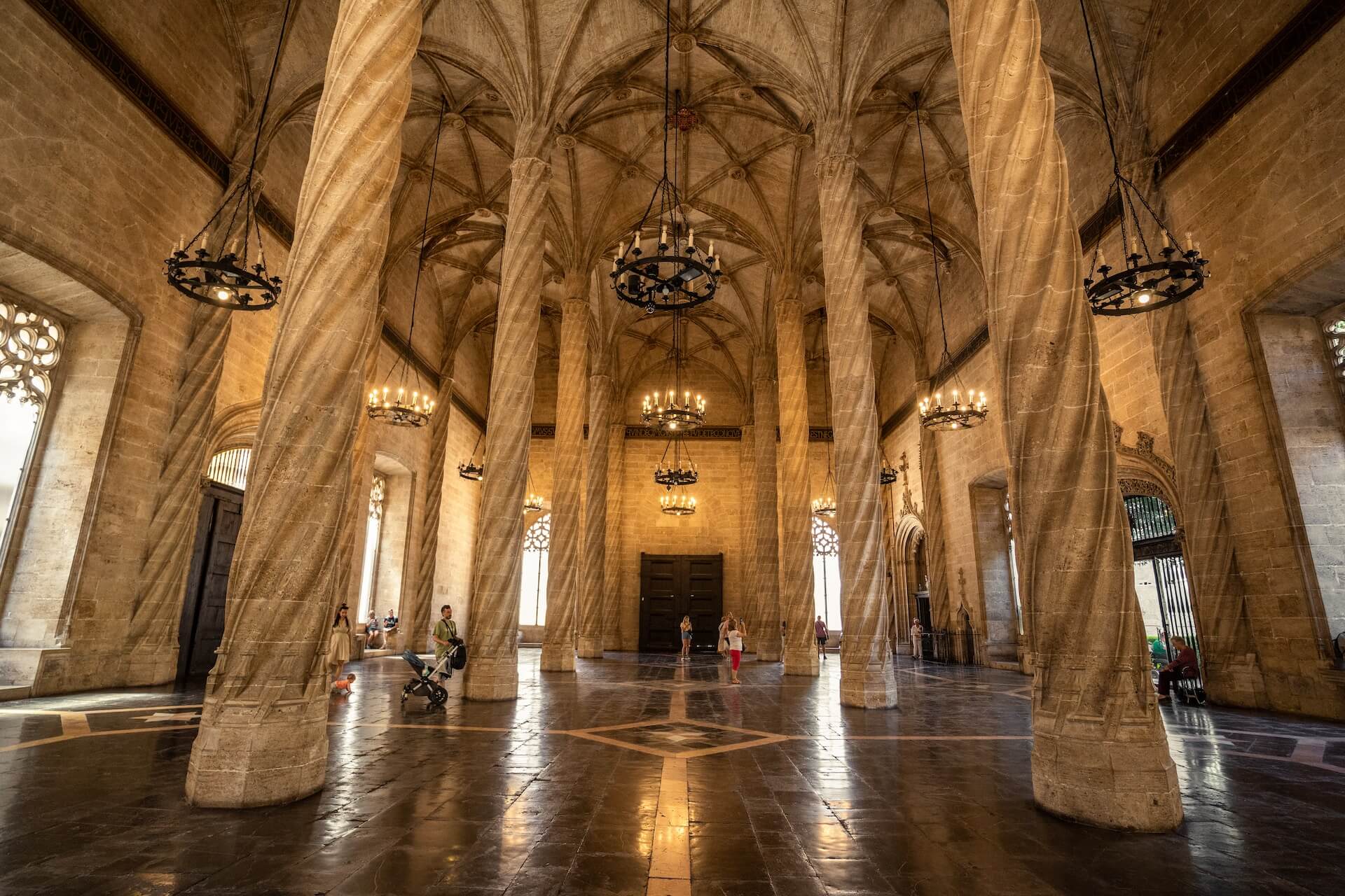 a large room with chandeliers