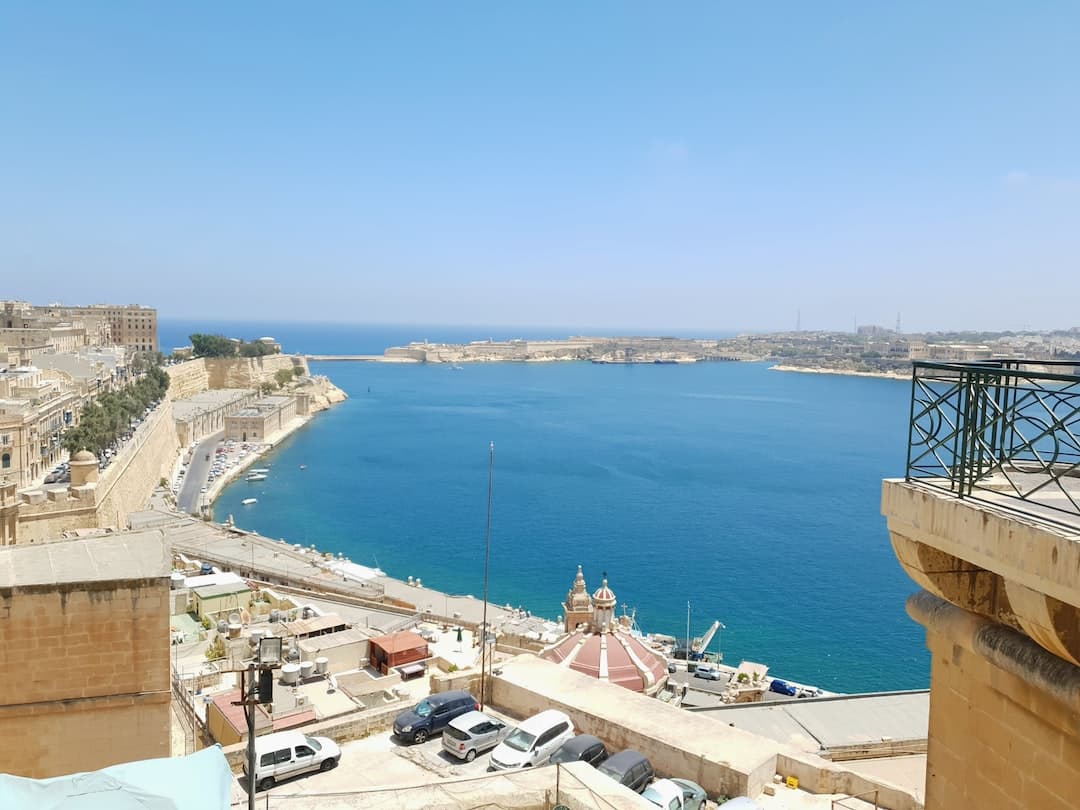 a large body of water sitting next to a city