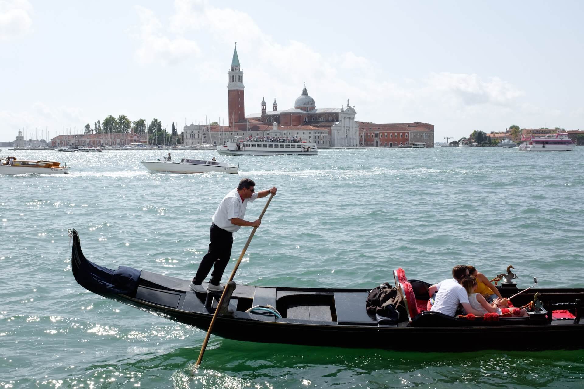 a woman in a hat is in a gondola