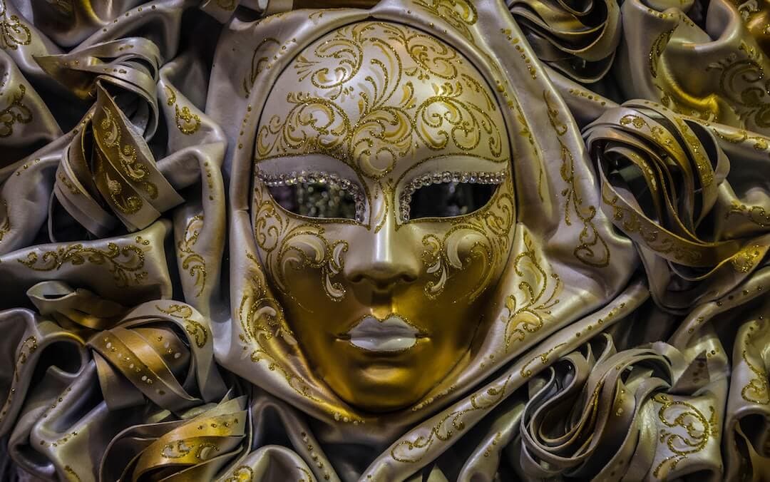 gold and white masquerade ball mask