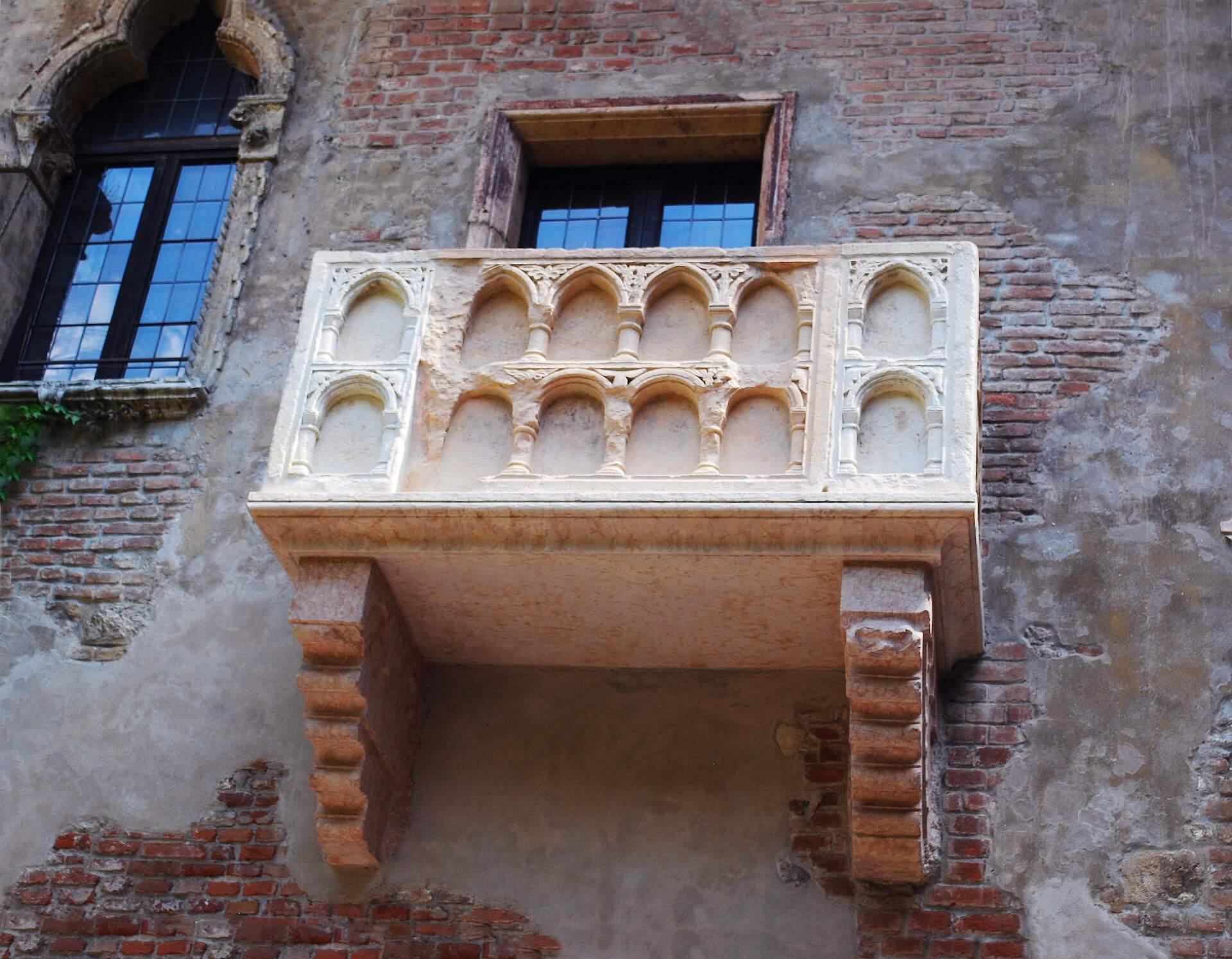 a balcony of a building with a window