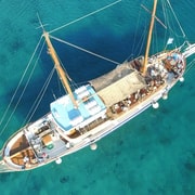 Mykonos: Sunset Party Boat Cruise with 1 Drink